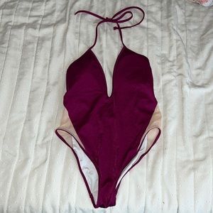 A Magenta one piece Pink Victoria Secret swimsuit